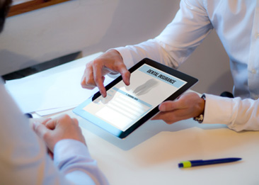 An insurance agent discussing dental insurance with a patient
