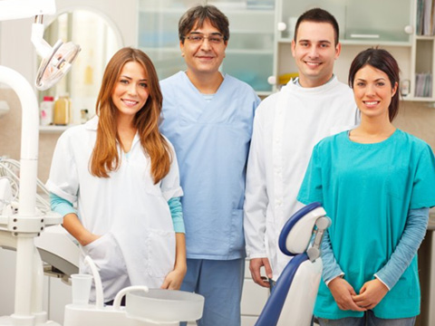 Dental team members happy in the office 