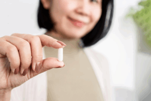 Close up of dentist holding an oral conscious sedation pill